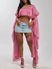 Pink draped square neck crop top with long flowing sleeves and a mini denim skirt.