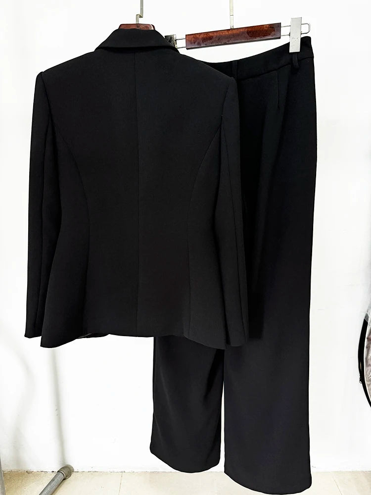 Back view of a black structured blazer and straight leg pants