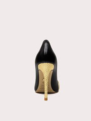 Black high-heeled shoe with gold snake skin pattern heel on a white background