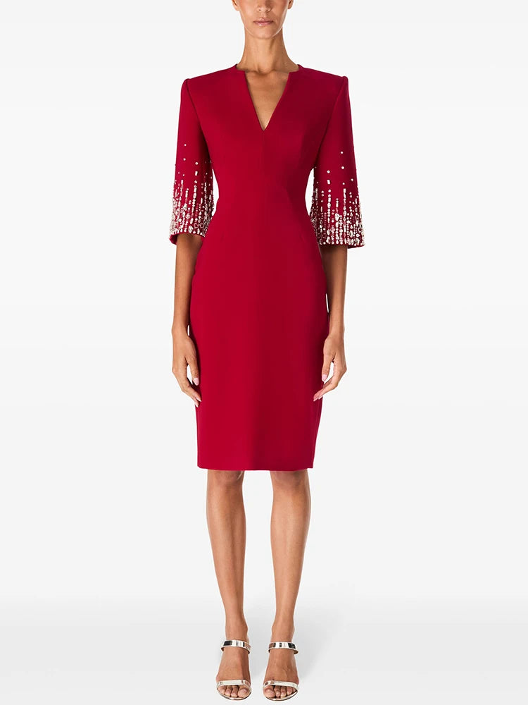 Red V-neck dress with beaded three-quarter sleeves