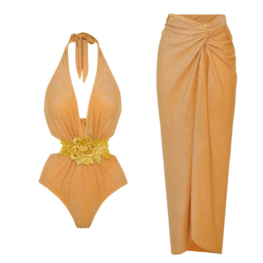 Orange halter neck cut-out swimsuit with floral applique and matching ruched wrap maxi skirt.