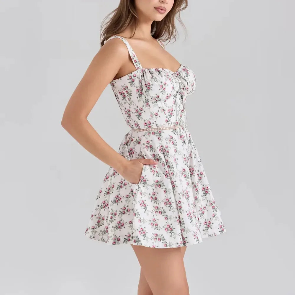 Woman wearing a floral dress on a plain background