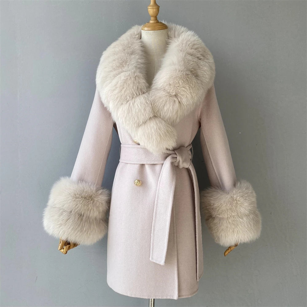 Pink coat with fur trim on a mannequin against a gray background
