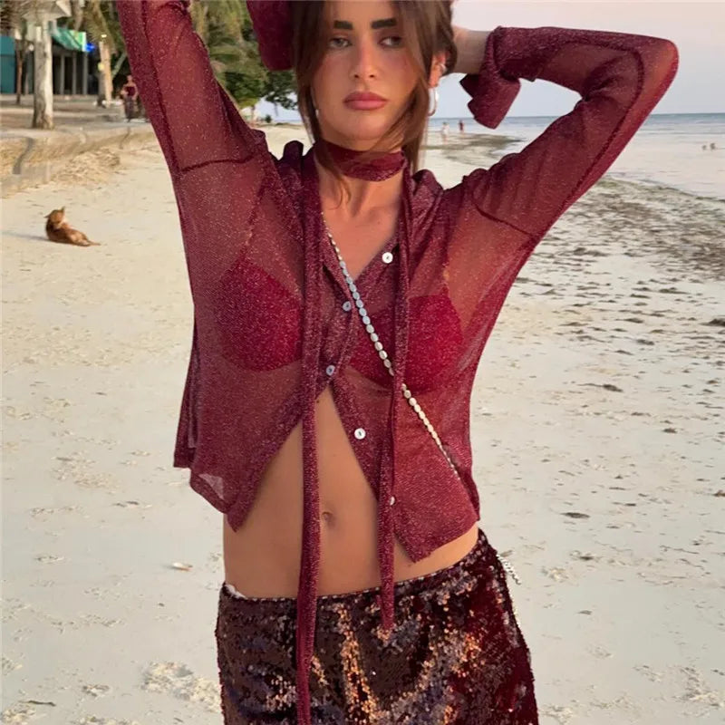Woman in a red outfit on a beach