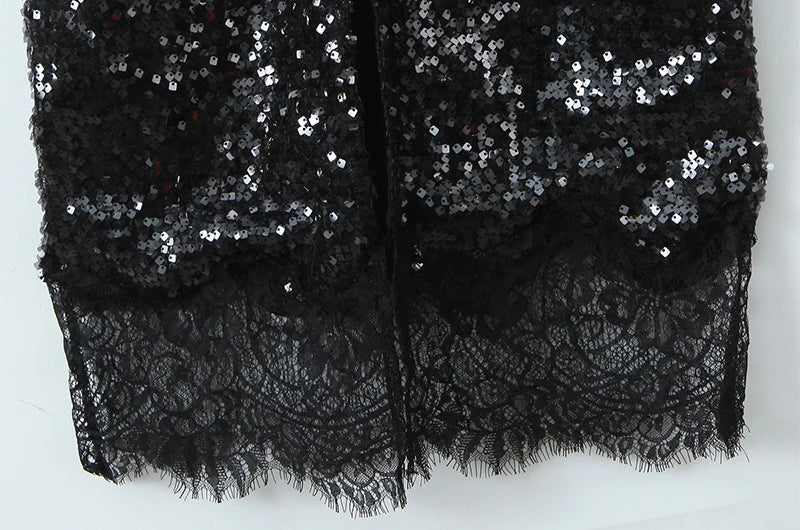 Close-up of lace trim and sequin detail on maxi dress hem
