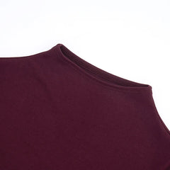 Close-up of a maroon sleeveless top on a white background