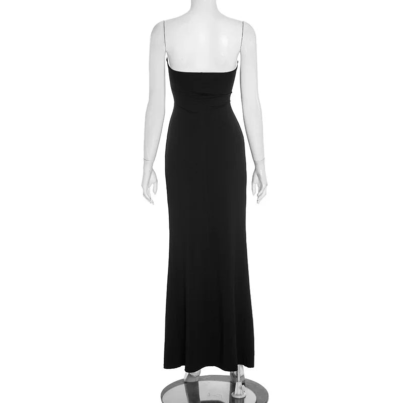 Black evening gown on a mannequin against a white background