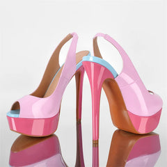 Pink high-heeled shoes with a blue accent on a reflective surface.