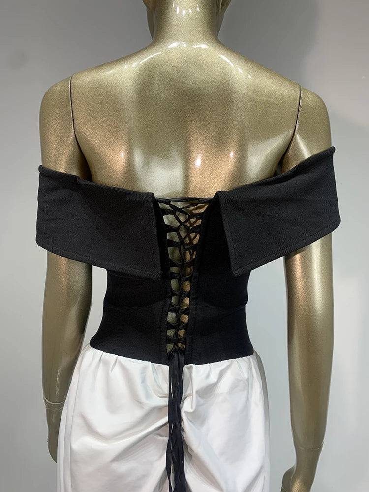 Black off-shoulder top with lace-up back on a mannequin against a gray background
