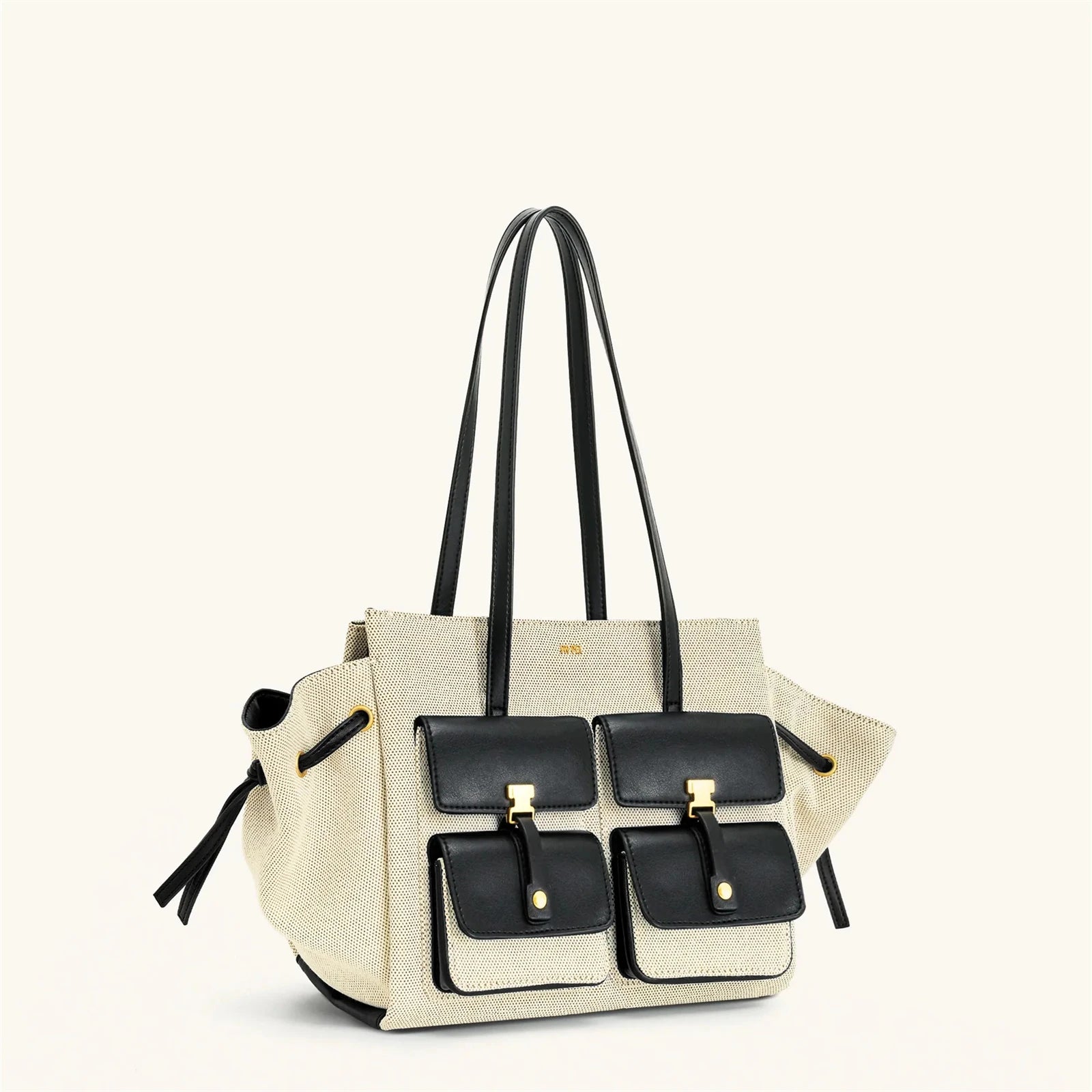 Beige handbag with black accents on a white background