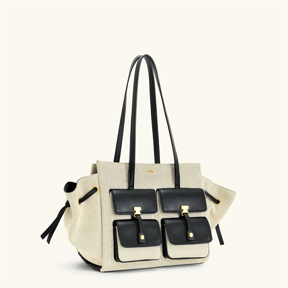 Beige handbag with black accents on a white background