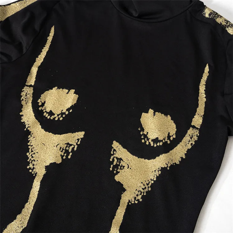 Black garment with gold abstract designs on a white background