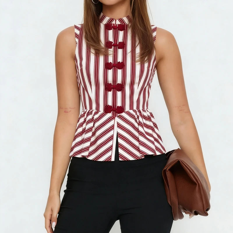 Model wearing the striped peplum top with black trousers