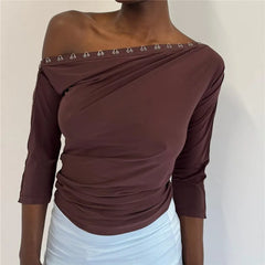 Brown off shoulder top with eyelet detail on neckline and sleeve