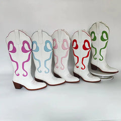 Assortment of pointed toe knee high cowboy boots with various bow colors