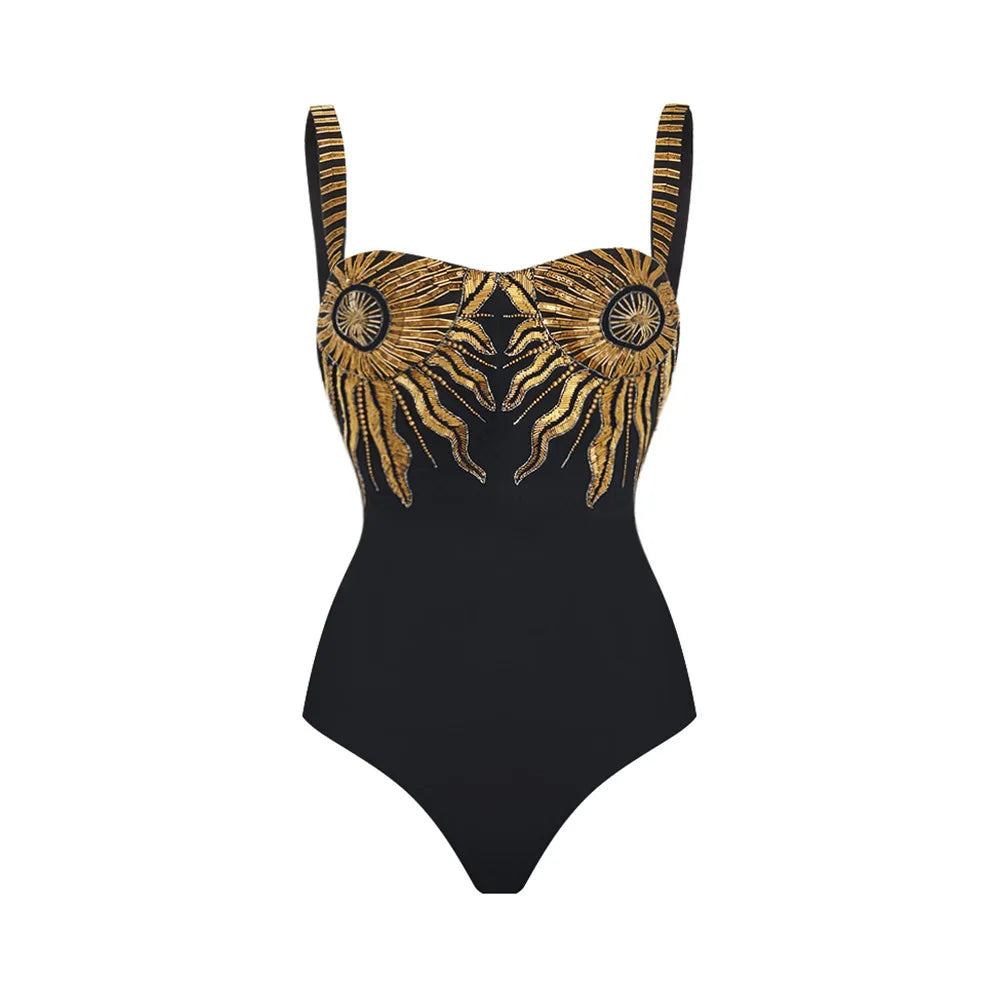 Black one-piece swimsuit with golden sunburst embroidery on the bust.