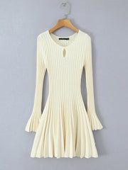 White ribbed dress on a wooden hanger - full flare sleeves
