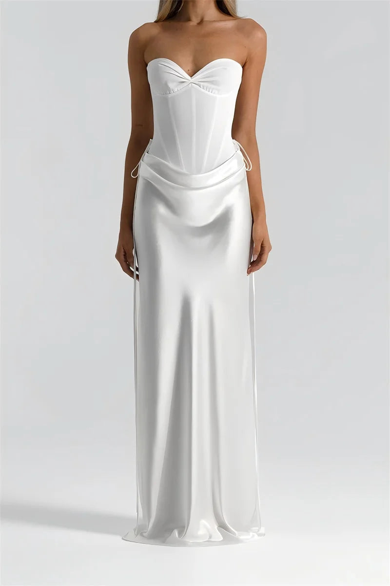 White strapless gown on a plain background
