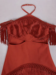 Red halter top with fringe details on a white background