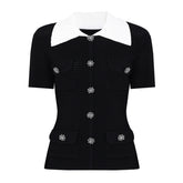 Black knit cardigan with white collar and crystal buttons
