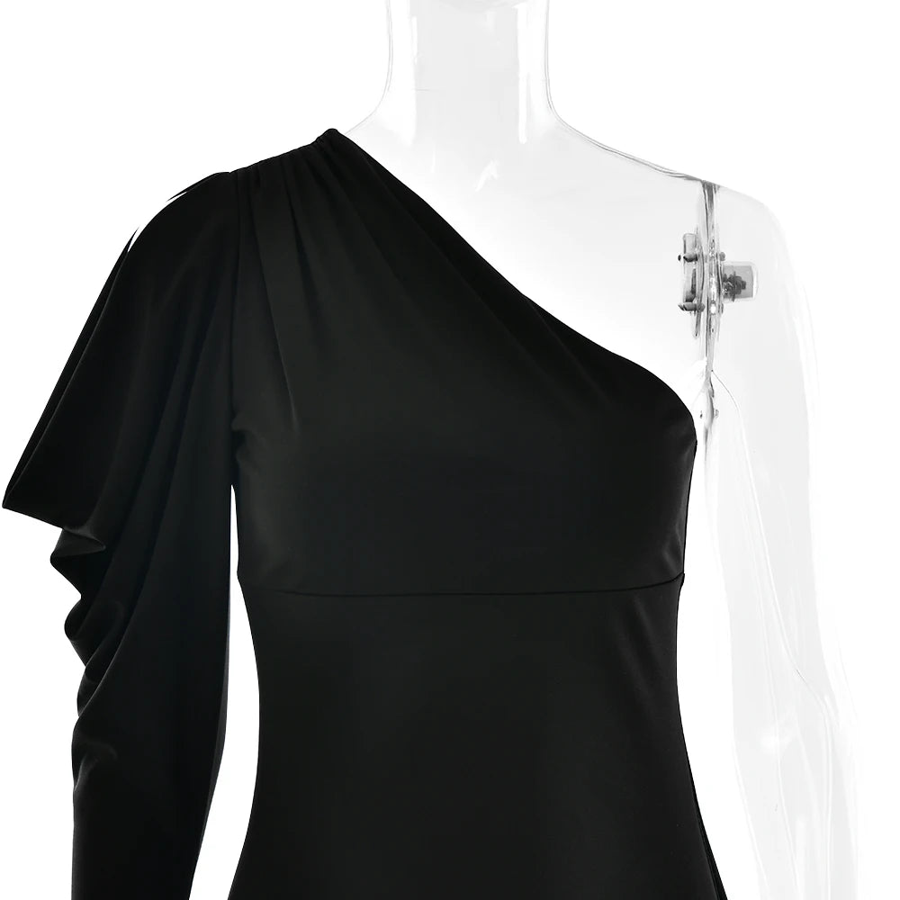 Black one-shoulder dress on a mannequin against a white background