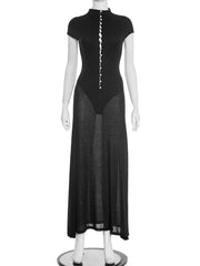 Black dress with a sheer overlay on a mannequin against a white background