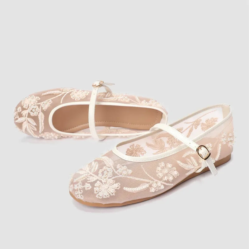 Light-colored embroidered mesh ballet flats