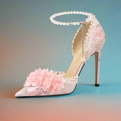 Pink high-heeled shoe with floral design on a white background