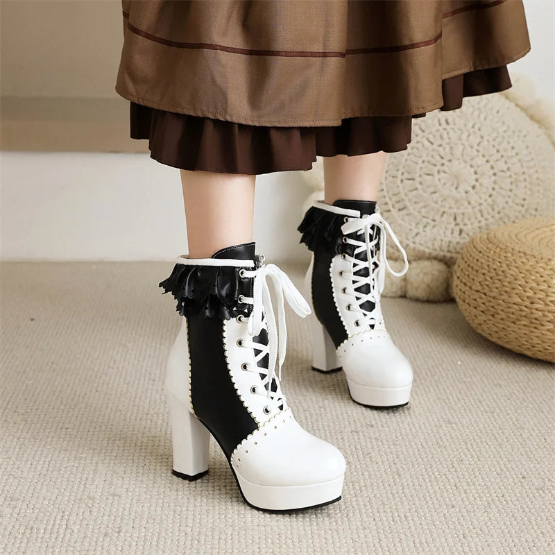 White platform boots with black accents worn with a brown skirt.