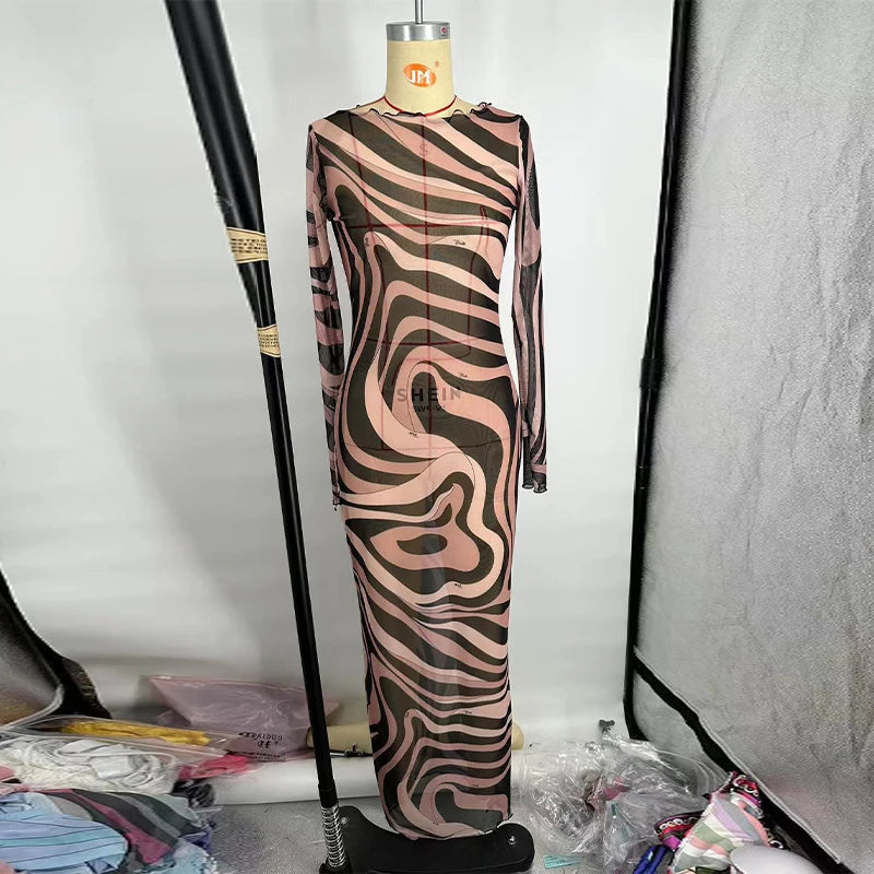 Mannequin wearing a zebra-striped dress against a plain background