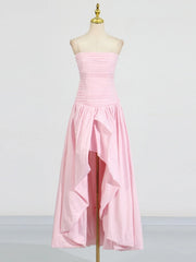 Pink strapless dress on a mannequin against a plain background