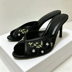 Black embroidered floral stiletto mules