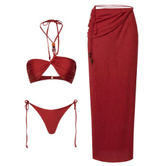 Red twisted bikini top and matching maxi skirt cover-up set with beaded detailing.