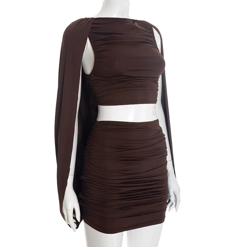 Brown ruched dress with a white belt on a mannequin against a white background