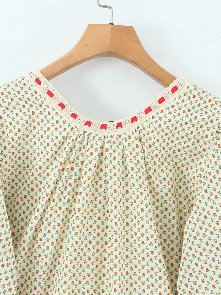 Detail of the O-neckline and decorative trim on a mini dress.
