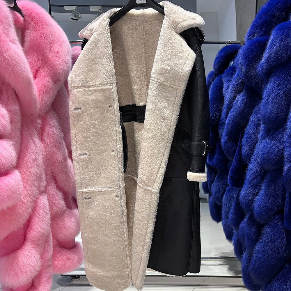 Beige fur coat displayed with pink and blue furs on either side.