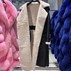 Beige fur coat displayed with pink and blue furs on either side.