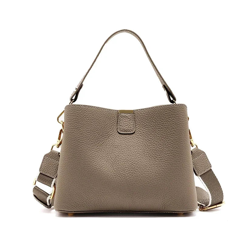 Gray handbag with a strap on a white background