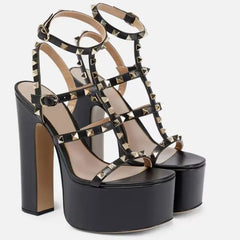 Black platform sandals with gold studs