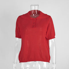 Red top on a mannequin against a white background