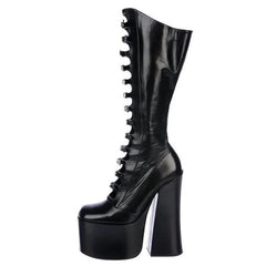 Black platform boot with high heel on a white background