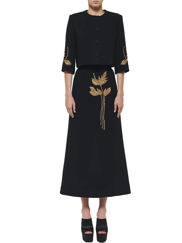 Beaded cropped jacket and midi skirt suit on model