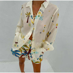 Beige shirt with colorful patterns on a plain background