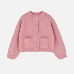 Pink knitted cardigan on a light gray background