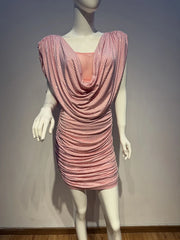 Mannequin wearing a pink beaded dress against a plain background