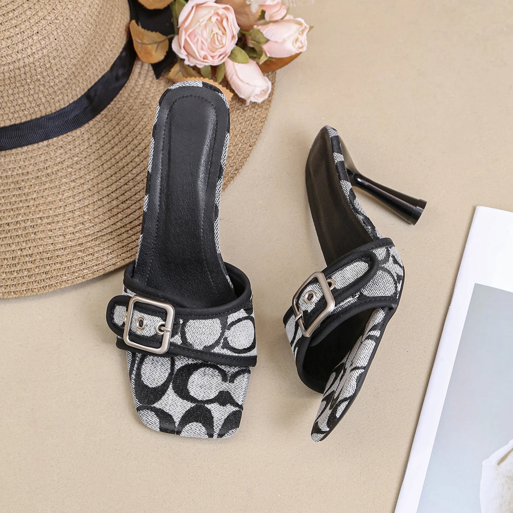 Pair of square toe stiletto heels with black and white print