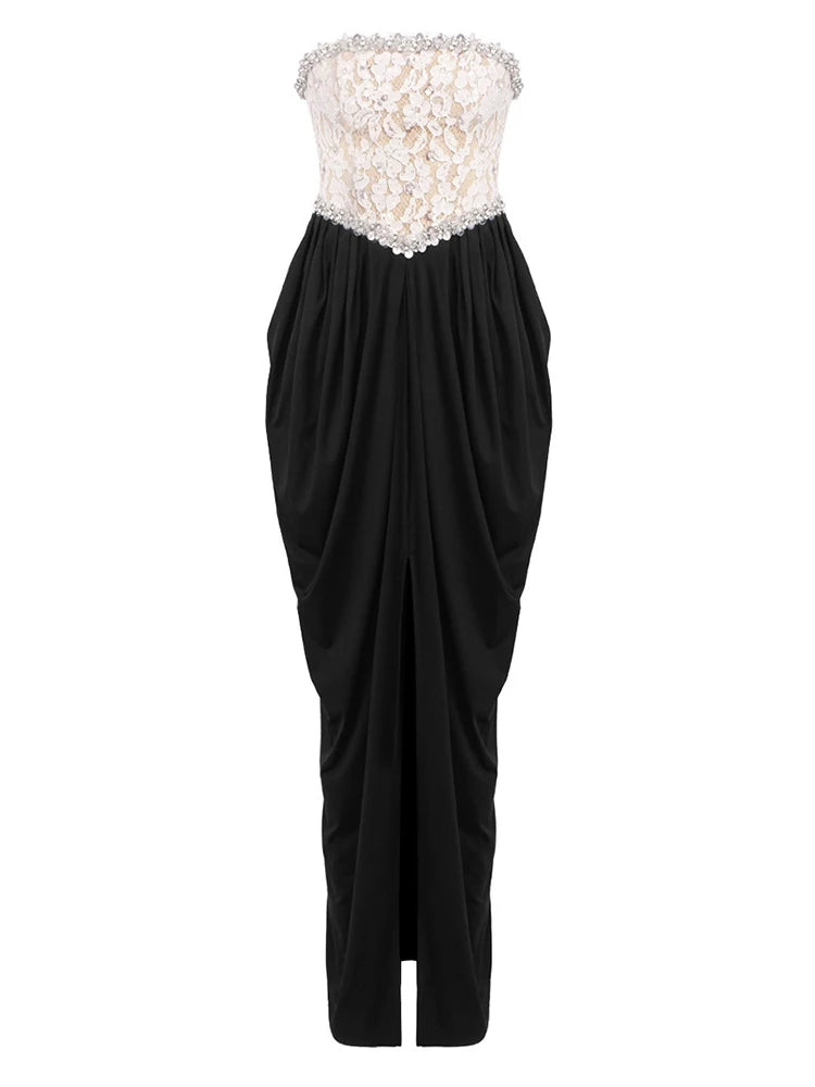 Black strapless gown with floral embellishments on a white background