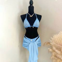 Light blue embellished bikini top with sparkling accents and chiffon wrap skirt.