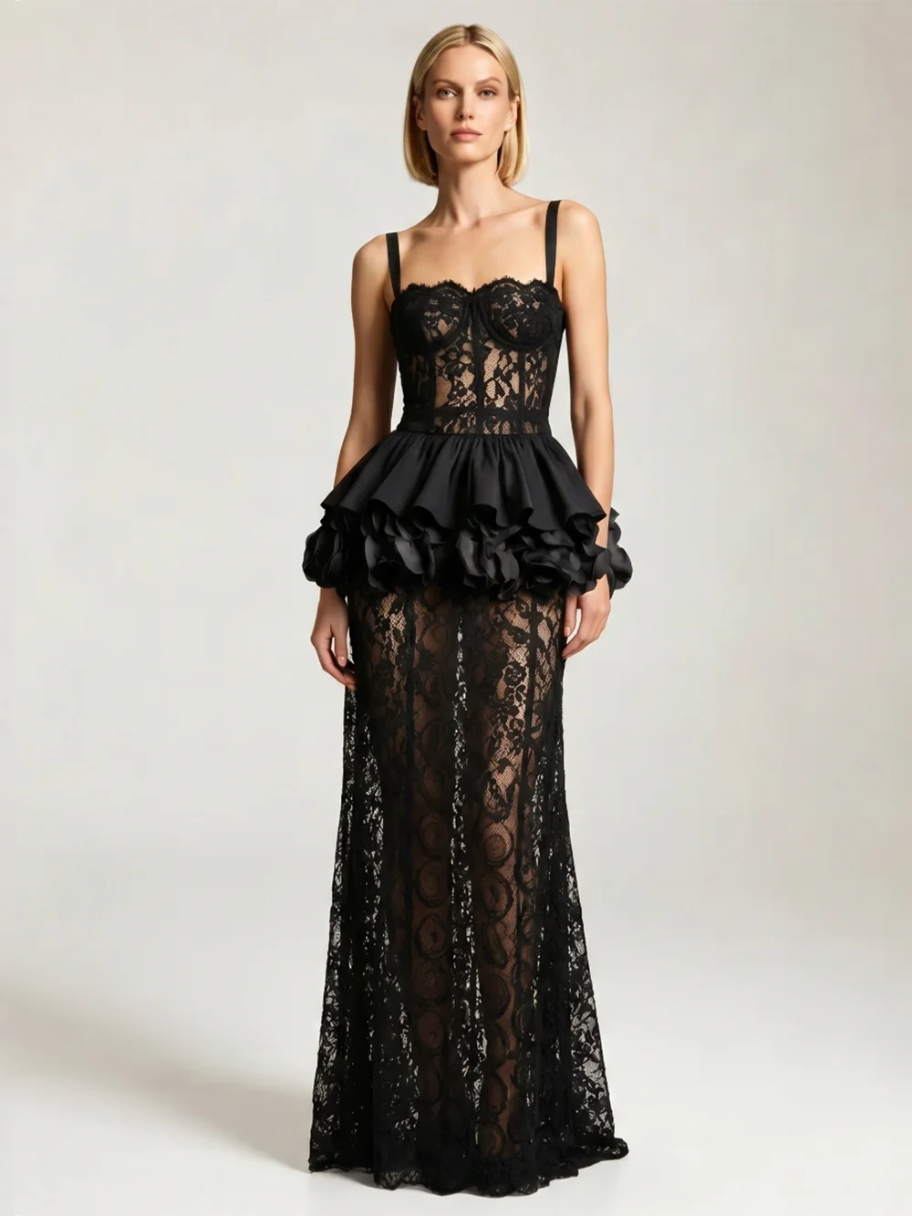 Black lace corset top and sheath skirt set with spaghetti straps and a flounce detail.