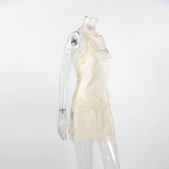 Mannequin wearing a light-colored dress on a white background